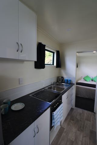 one bedroom 9 metre cabin kitchen to bedroom